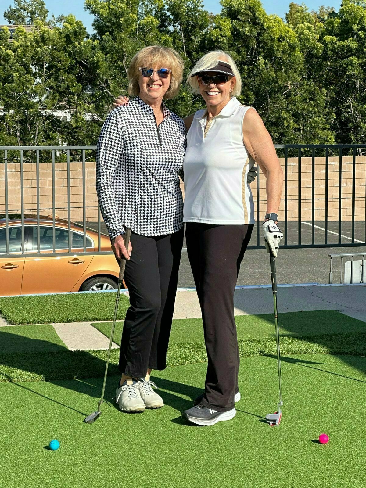 Image: Christine Latham and Karen Kringl at their golf lesson getting ready for the Rosary Women&#39;s Golf Open.  Chris and Karen are retired Professors of Nursing from Cal State Fullerton University.